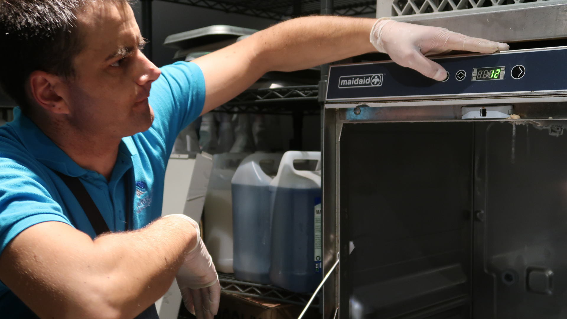 Engineer fixing dishwasher