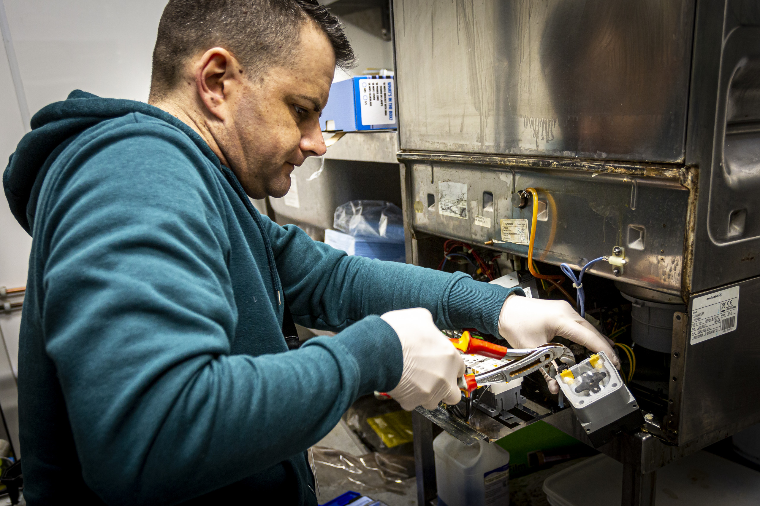 Engineer repairing fridge