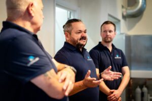 Senior engineer briefing the team at facility